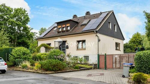 Außenansicht 1 - Einfamilienhaus mit Einliegerwohnung, großem Grundstück und vielseitigen Nutzungsmöglichkeiten