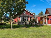 Gartenansicht - Charmanter Holzbungalow auf Eckgrundstück