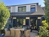 Gartenansicht - Charmantes Reihenmittelhaus mit Garten und Garage in gefragter Lage