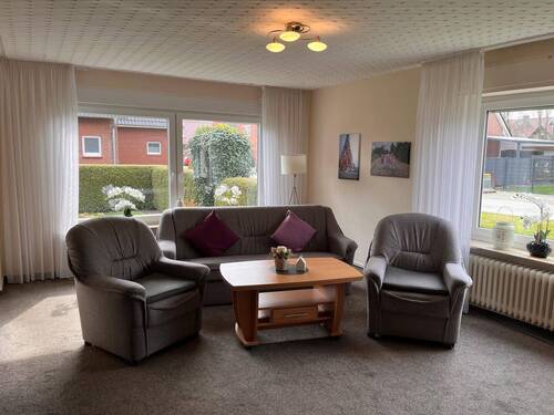 Wohnzimmer im Erdgeschoss - 6 Zimmer Mehrfamilienhaus, Wohnhaus in Wietmarschen