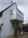 Hauseingang mit Balkon-Wintergarten - 