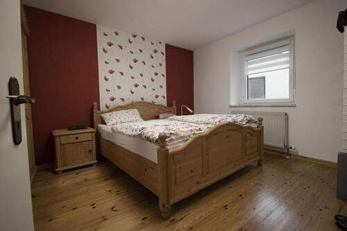 Schlafzimmer im Erdgeschoss links - 