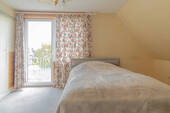 Schlafzimmer mit Zugang zum Balkon - 