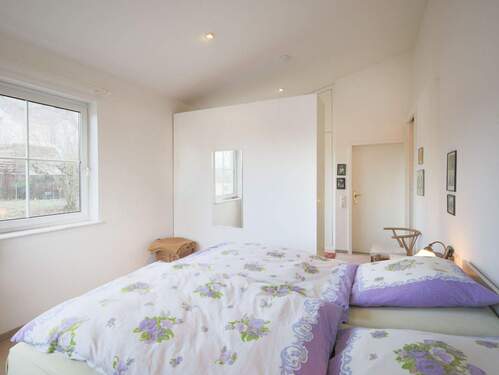 Gemütliches Schlafzimmer mit Ankleide und Badezimmer en-suite - 