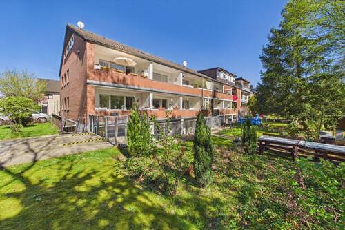 Gartenansicht - Attraktives Investment: MFH mit 12 WE, Kita, Büro und Ausbaureserve in ruhiger Lage