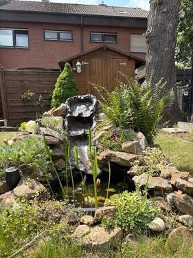 Gartenteilansicht - Reihenmittelhaus mit 99,20 m&sup2; in Rheine zum Kaufen