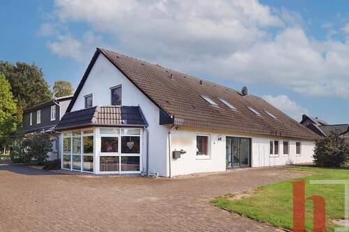 Außenansicht mit Wintergarten - 2 Zimmer Einfamilienhaus zum Kaufen in Wagenfeld