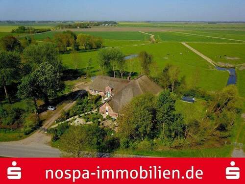 Außenansicht - Wohnen ohne Hindernisse! Ebenerdiges Wohnen unter Reet auf ca. 130 m²!