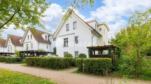 Außenansicht 1 - Gepflegte 2-Zimmer-Wohnung mit Terrasse und Tiefgaragenstellplatz in ruhiger Lage