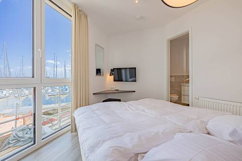 Schlafzimmer mit angrenzendem Duschbad en Suite - Terrassenwohnung mit 79,00 m² in Wendtorf zum Kaufen