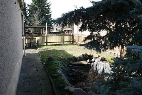 Zugang mit Teich - Einfamilienhaus mit 109,00 m² in Mügeln zum Kaufen