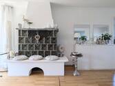 Wohnzimmer mit Kachelofen - Einfamilienhaus mit 217,00 m² in Maulbronn zum Kaufen