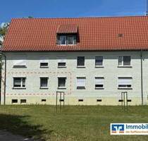 Gepflegte 4-Zi.-Erdgeschosswohnung mit Gartenblick, zwei Kellerräumen und Garagenoption! - Breddin