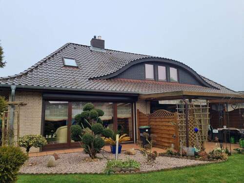 Gartenansicht - Walmdachbungalow mit Einliegerwohnung