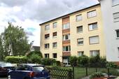 Hausansicht - Gepflegte 4-Zimmer-Wohnung mit Balkon & Garage in zentraler Lage von Maintal
