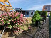Gartenbereich mit Holzhaus - 