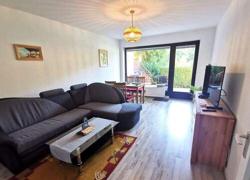Wohnzimmer zur Terrasse hin - Etagenwohnung mit 62,90 m&sup2; in Holzminden / Silberborn zur Miete