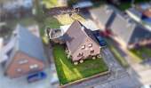 Luftbild - Einfamilienhaus mit großem Grundstück in zentraler Lage von Nortorf
