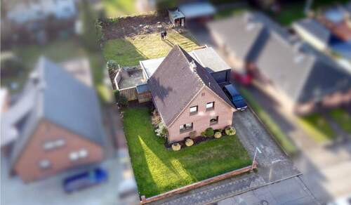 Luftbild - Einfamilienhaus mit großem Grundstück in zentraler Lage von Nortorf