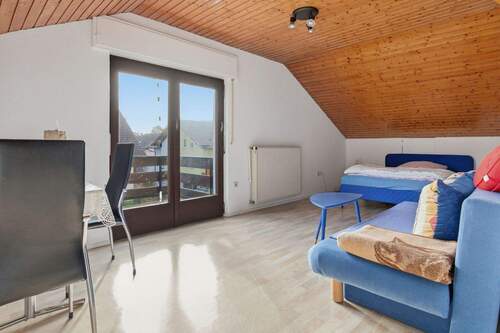 Schlafzimmer/Wohnzimmer Dachgeschoss mit Balkon - 
