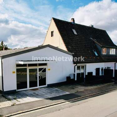 Bild 2 - 6 Zimmer Mehrfamilienhaus, Wohnhaus zum Kaufen in Arnstein