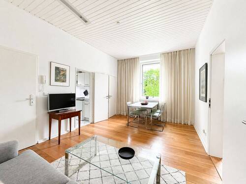 Wohn-/Essbereich Ansicht I - Attraktive Zwei-Zimmer-Wohnung mit Terrasse und Garten zur Mitnutzung