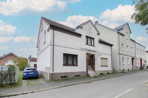 1. Ansicht - Ihr Projekt mit Potenzial - Geräumiges Zweifamilienhaus mit großem Grundstück in Bochum