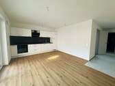 Wohn-/ Essbereich - Exklusive 2,5-Zimmer-Wohnung im Neubau — zentral, nachhaltig, attraktiv