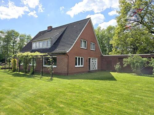 seitliche Ansicht - 9 Zimmer Einfamilienhaus zum Kaufen in Uplengen / Nordgeorgsfehn