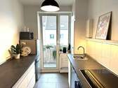 eine Küche mit Balkon - 
