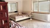 Wohnzimmer mit Kachelofen OG - 