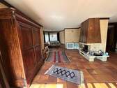 Wohnzimmer im Erdgeschoss mit offenen Kamin und... - 7 Zimmer Mehrfamilienhaus, Wohnhaus in Zell