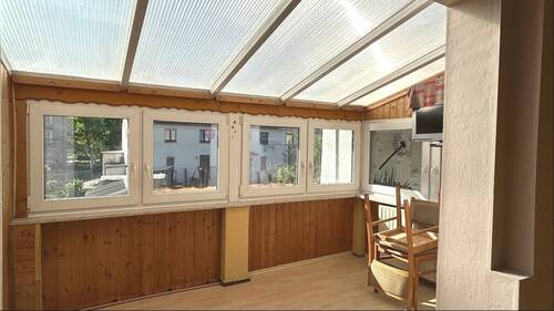 Wohnzimmer mit Wintergarten - 