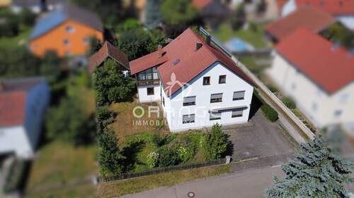 Außenansicht - Anleger & Selbstnutzer: Vermietetes Haus mit kurzfristig kündbarem Vertrag und steuerlichem Mehrwert