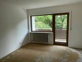 Zimmer mit Balkonzugang im Obergeschoss - 