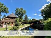 Aussenansicht Haus mit Teich - Haus in beliebter Lage von Buchholz mit zusätzlicher Mieteinnahme durch vermietete Wohnung im OG