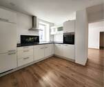 Moderne Einbauküche im Mietpreis inbegriffen - Blick ins Wohnzimmer - Etagenwohnung mit 52,60 m² in Damflos zur Miete