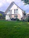 Blick vom Garten auf das Haus - Einfamilienhaus mit 142,00 m² in Wiefelstede zum Kaufen