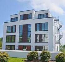 Neuwertige Obergeschosswohnung mit Tiefgaragenstellplatz, Lift, modernster Erdwärmetechnik sowie Südloggia in zentraler Lage von Rastede