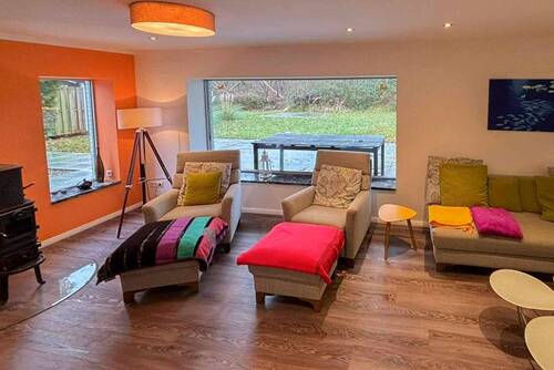 Wohnzimmer mit Kaminofen - 3 Zimmer Einfamilienhaus in Maasholm