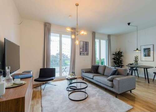 Wohnzimmer - 2 Balkone, TG & Aufzug: Lichtdurchflutete Neubauwohnung mit Südausrichtung im Nollendorfkiez