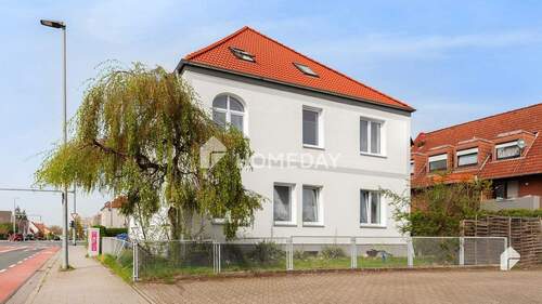 Außenansicht 3 - Attraktive Investitionsmöglichkeit: Mehrfamilienhaus mit 3 Wohneinheiten und Garten