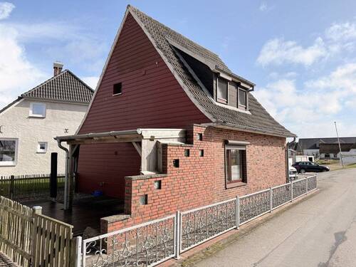 Seitenansicht mit Terrasse - Einfamilienhaus mit 80,00 m&sup2; in Nordstrand zum Kaufen
