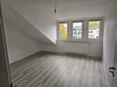 Wohnzimmer Ansicht 2 - 2 Zimmer Etagenwohnung in Bremen