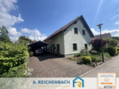 Straßenansicht - Familienfreundliches Einfamilienhaus mit Garten & Fußbodenheizung in ruhiger Lage von Bad Düben!