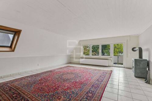 Wohnzimmer mit Balkon OG - 