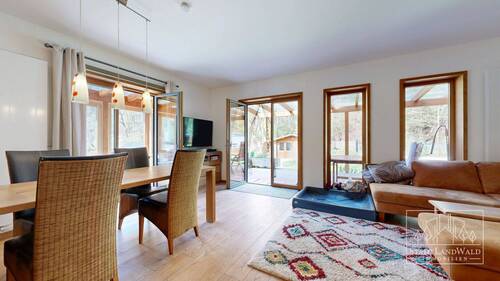 Wohn/Esszimmer mit Zugang zu Terrasse und Wintergarten - 