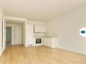 Ansicht I: Offener Wohn - und Küchenbereich - Stilvolle 2-Zimmer-Neubau-Oase mit Terrasse und EBK!