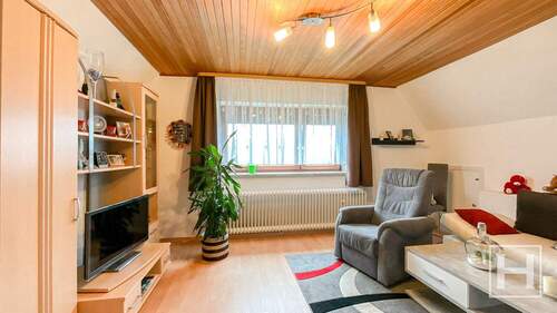 Gemütliches Wohnzimmer im Dachgeschoss - Einfamilienhaus mit 134,00 m&sup2; in Wahlstedt zum Kaufen