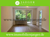 Wohnzimmer 1 - Wohnen im Grünen - Modernisierte Garten-Wohnung (EG) mit Terrasse - Duschbad- TG-Platz mögl.